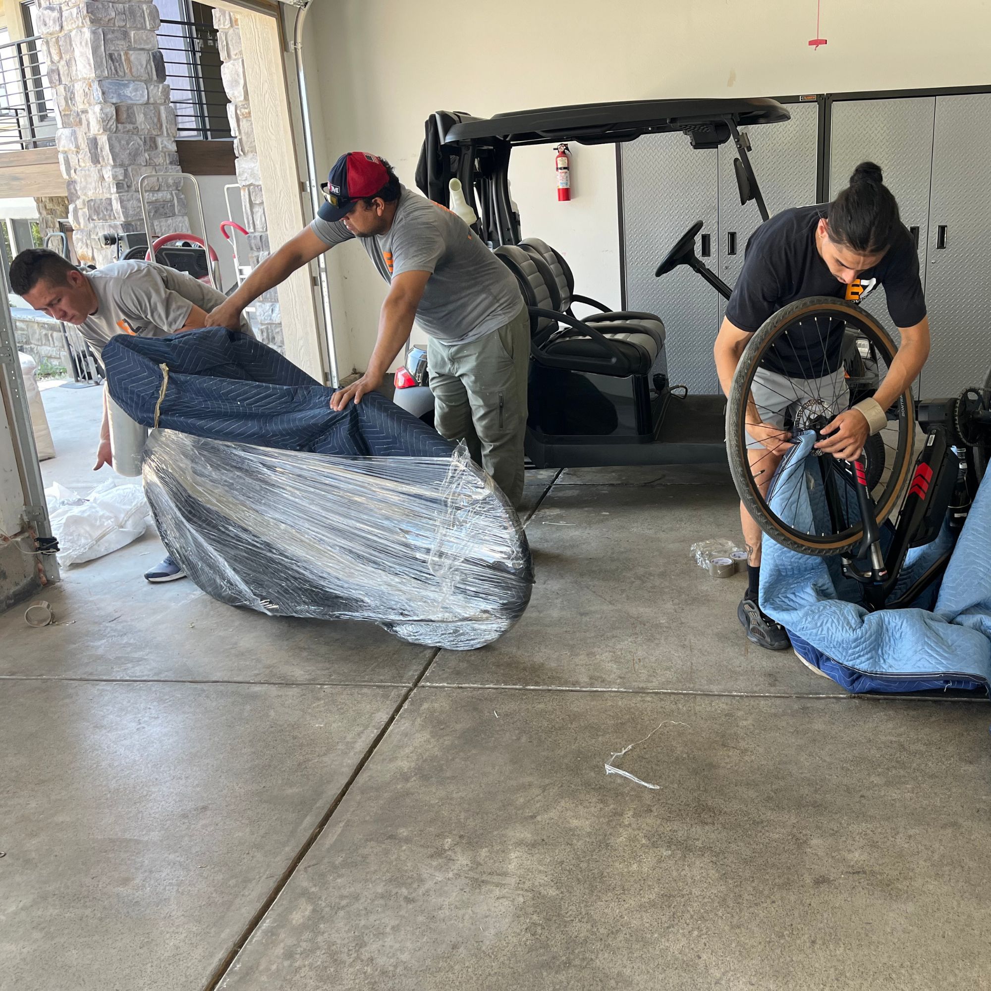 EZ Moving team wrap bikes inside of a garage