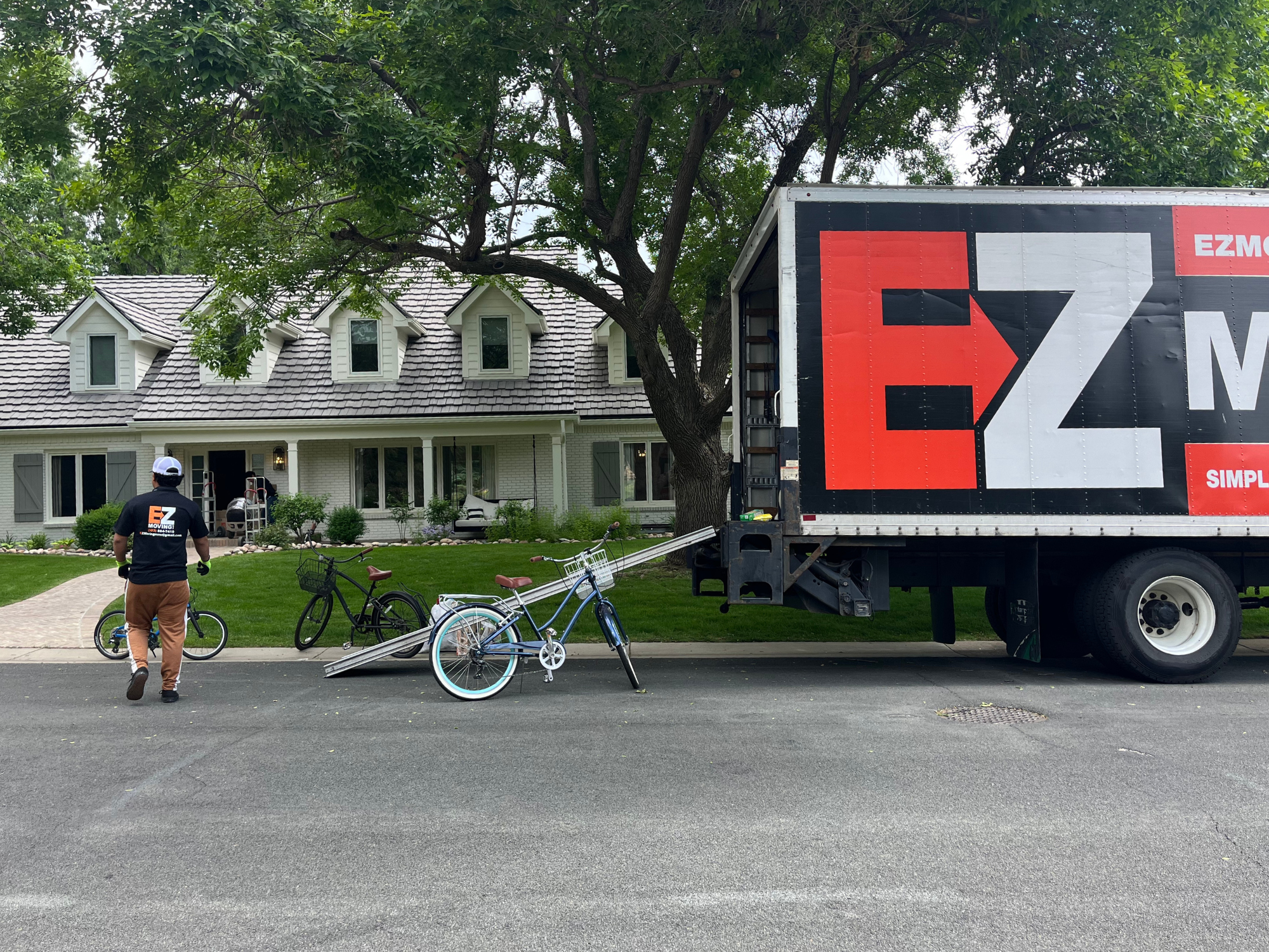 Bicycle being loaded into the EZ Moving truck in front of a house