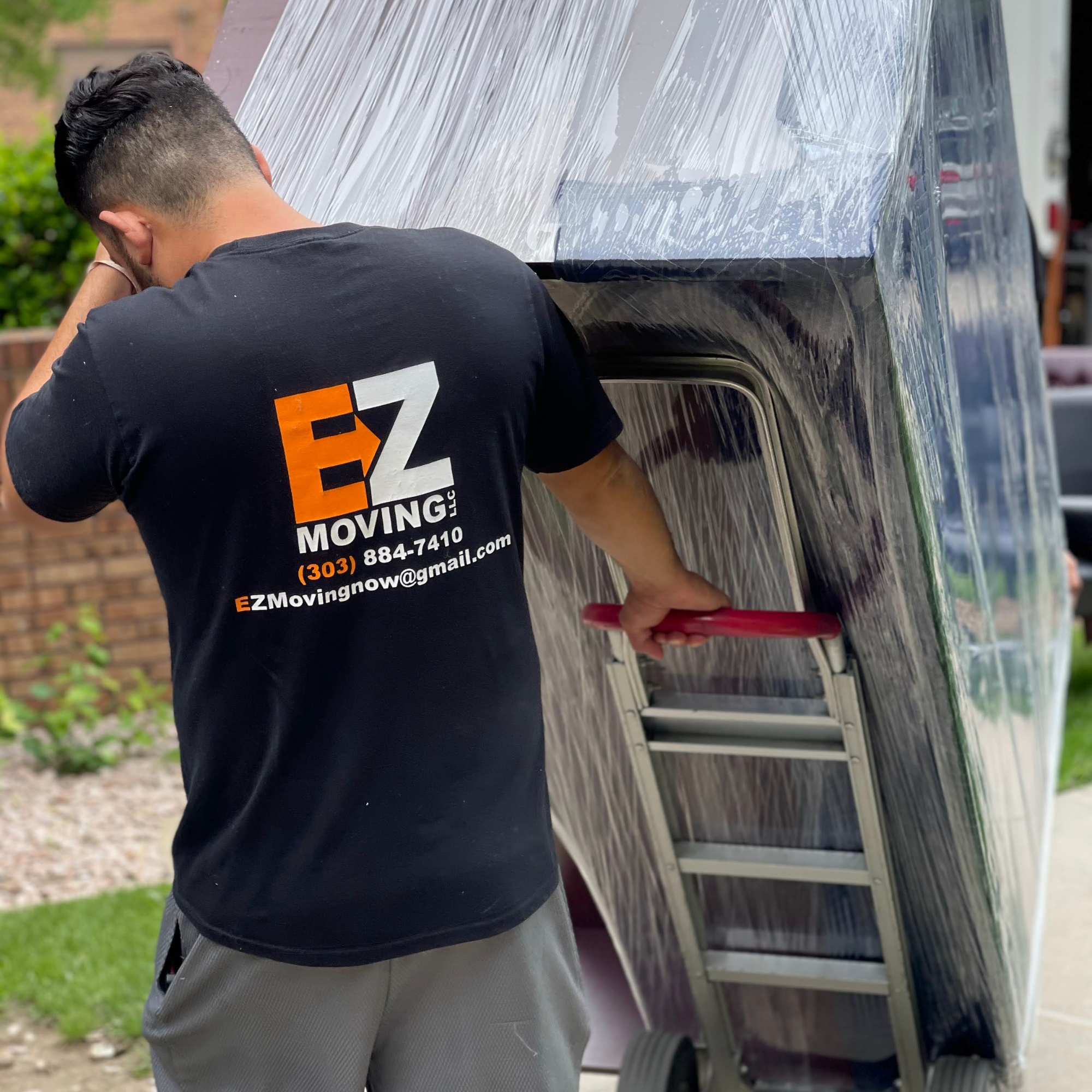 EZ Mover pulling heavy appliance up driveway