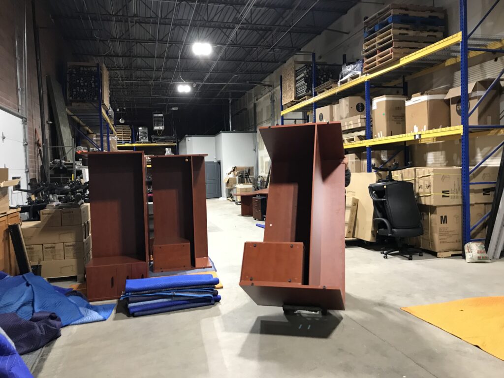 Moving furniture inside the EZ Moving secure storage facility