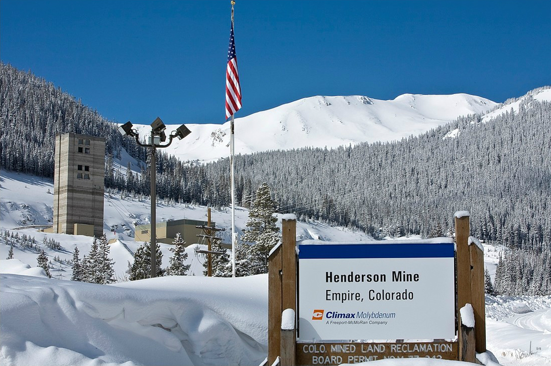 Henderson Mine sign with mountains