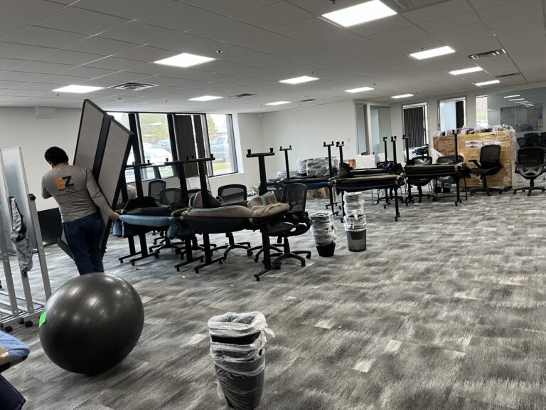 EZ Moving worker removing furniture from the office
