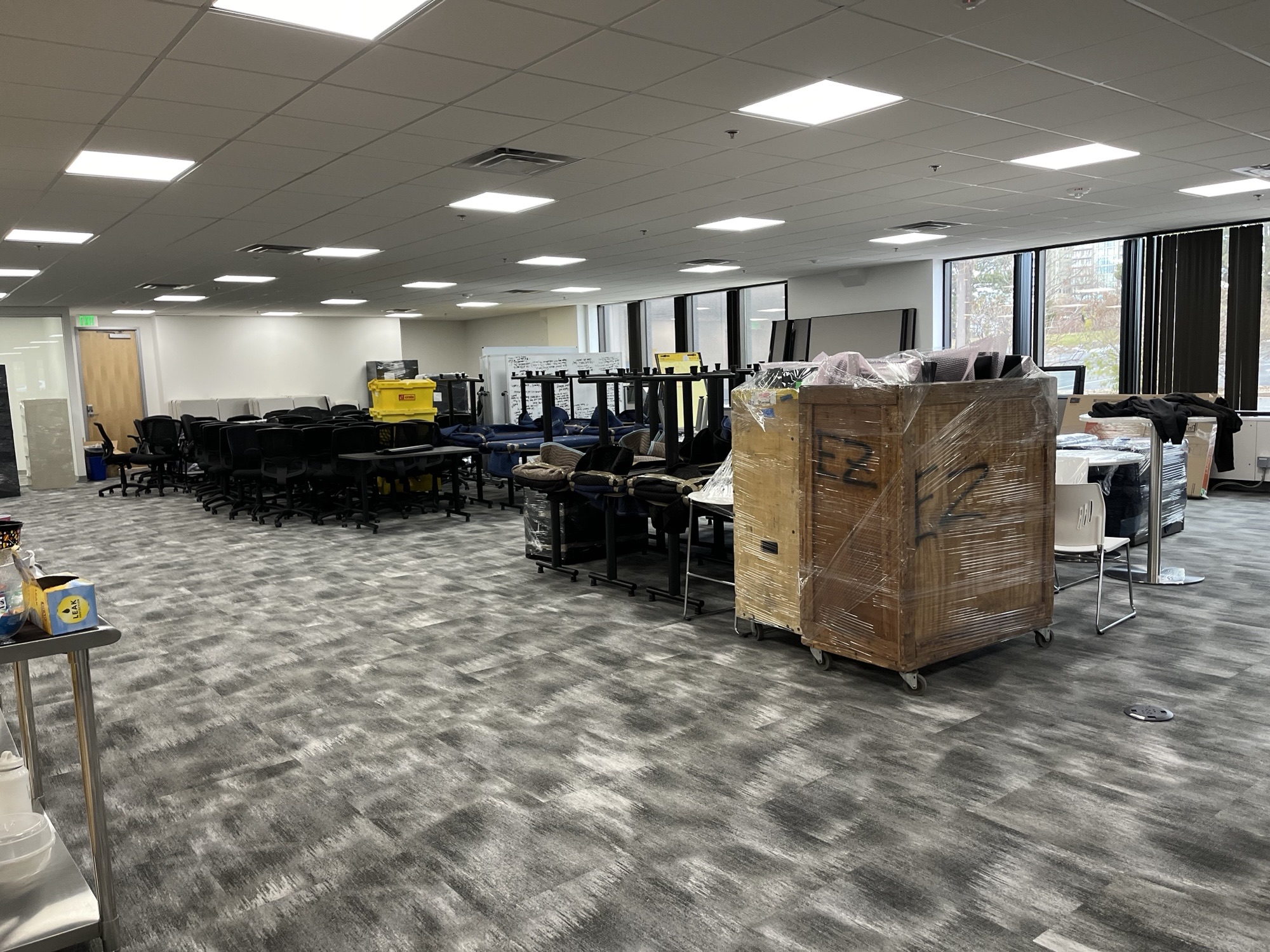 Office furniture packed up and ready to be removed by EZ Moving